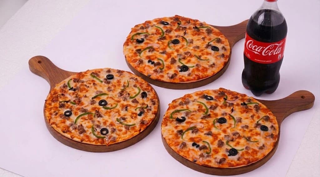 A medium pizza with two small pizzas and a 1.5 litre drink bottle