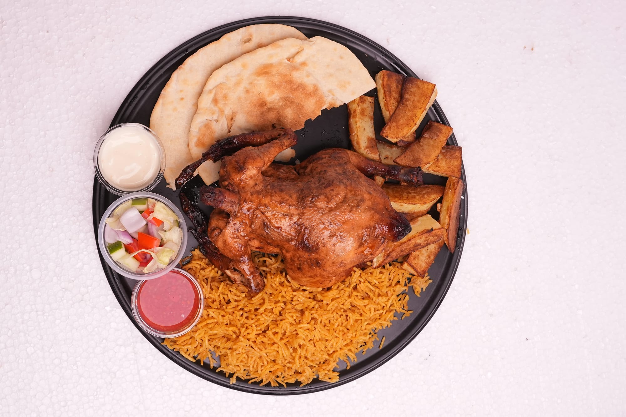 Whole roast chicken with spiced rice and naan